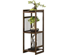 brown bamboo plant rack